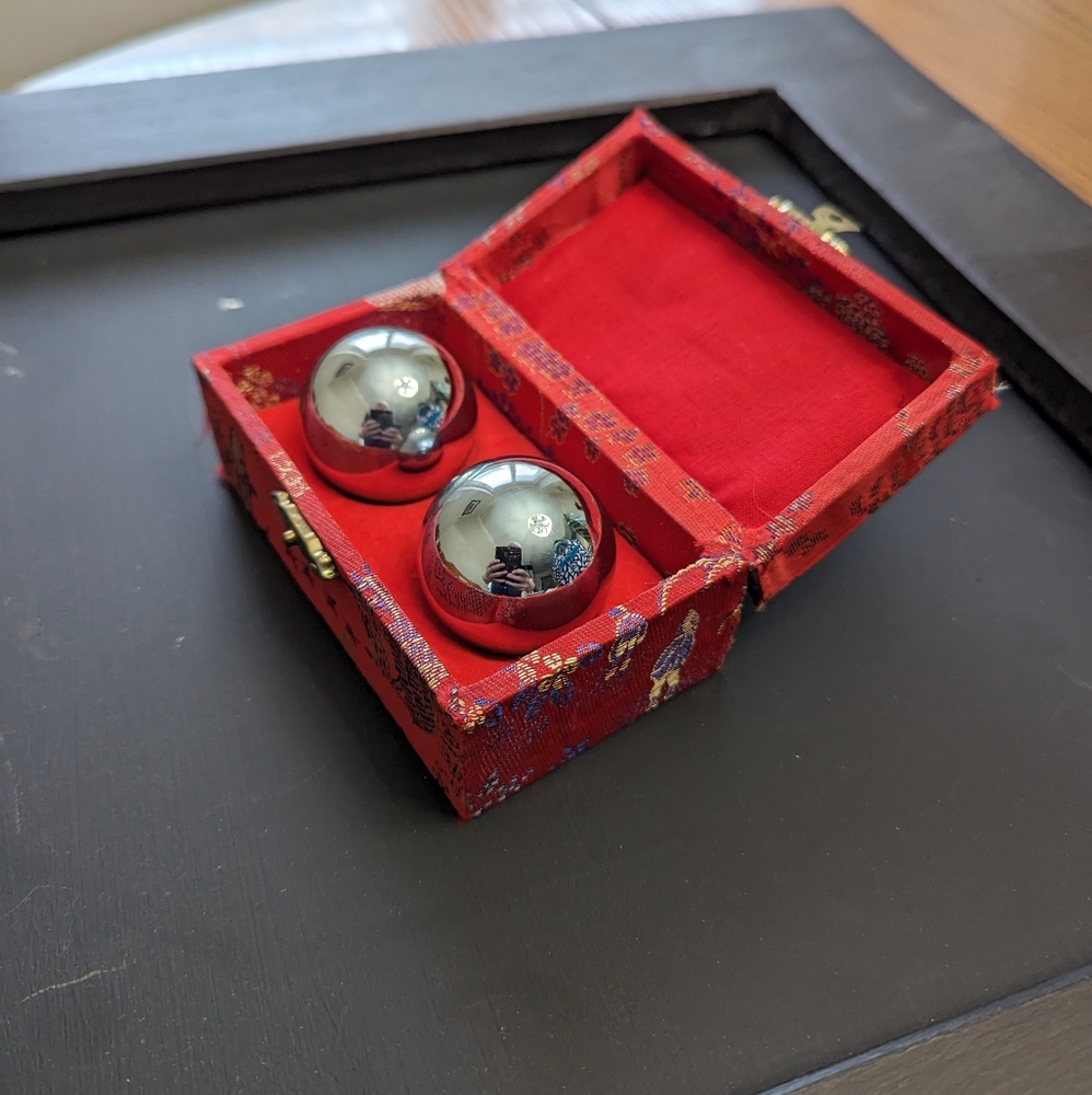 Chinese meditation baoding musical balls in a fabric covered case. EUC